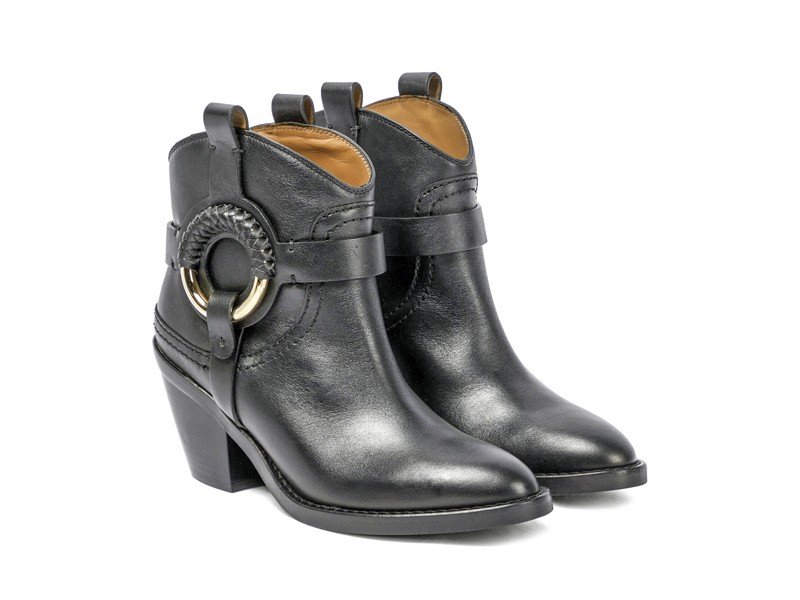 Cowboy boots with tall shafts and pointed toes