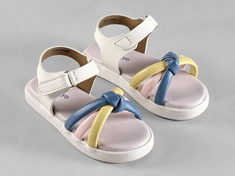 Open children’s shoes: Joyful steps