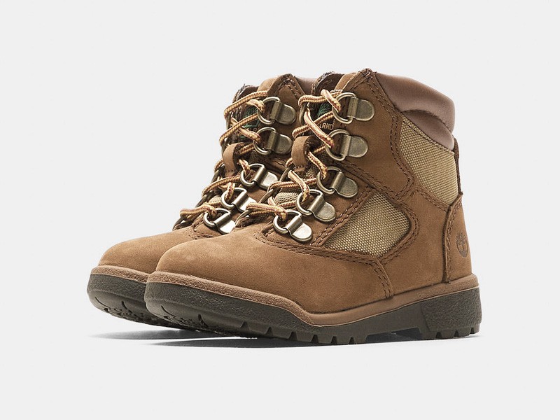 Kids outdoor footwear with traction soles and protective reinforcements