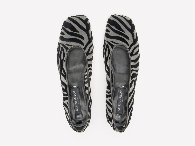 Animal-print ballerinas focus on surface and contrast
