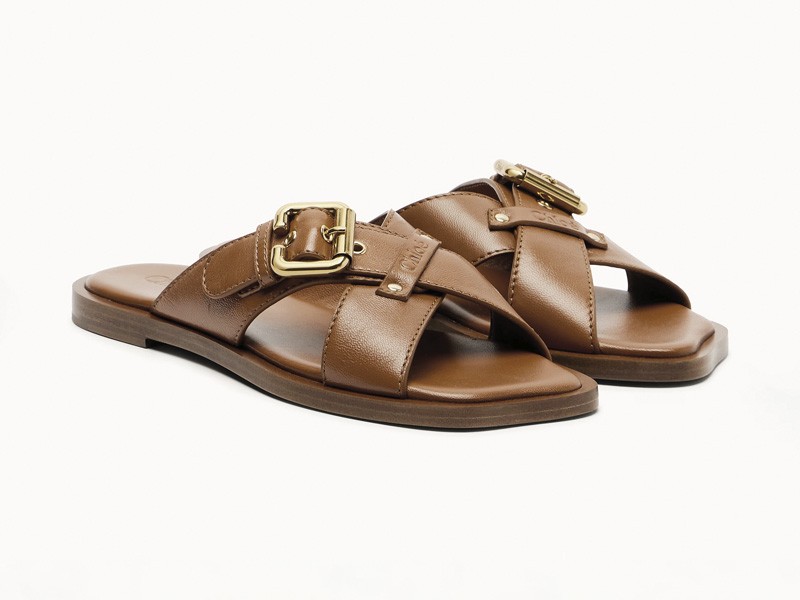Hardware transforms sandals through buckles, studs and crossings