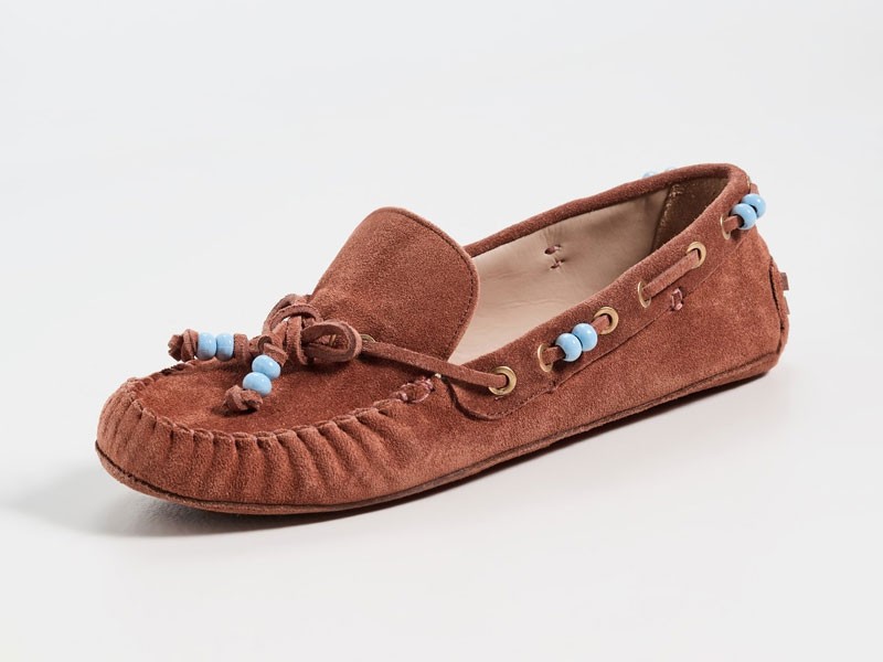 What is the origin of the gathered seam in moccasins?