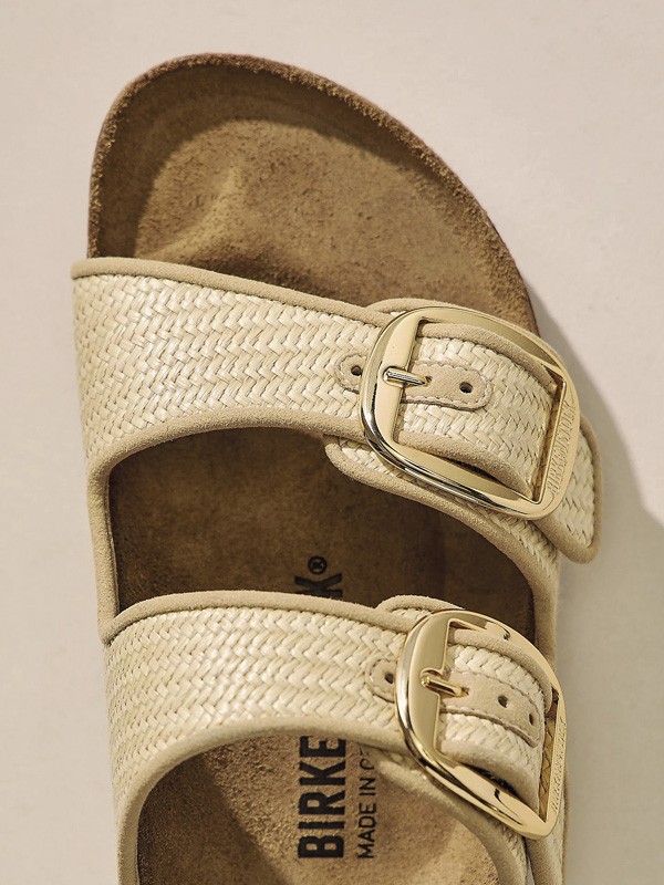 Hardware transforms sandals through buckles, studs and crossings