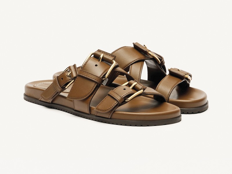 Hardware transforms sandals through buckles, studs and crossings