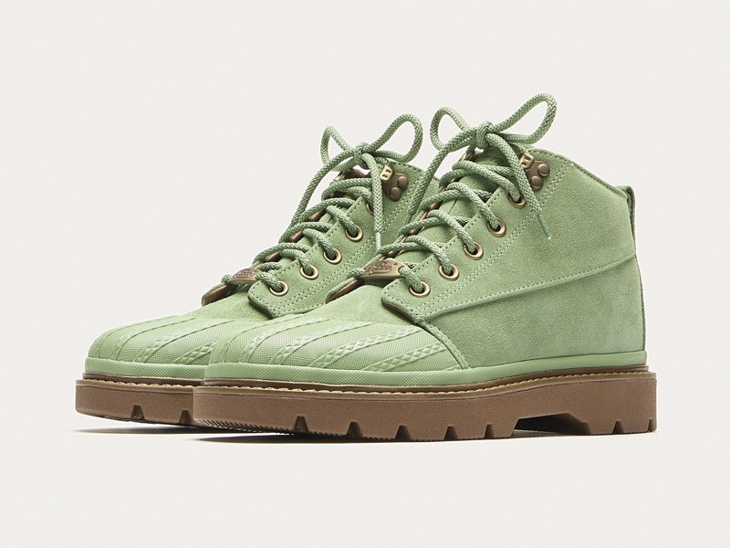 Workwear boots with track soles and visible stitching