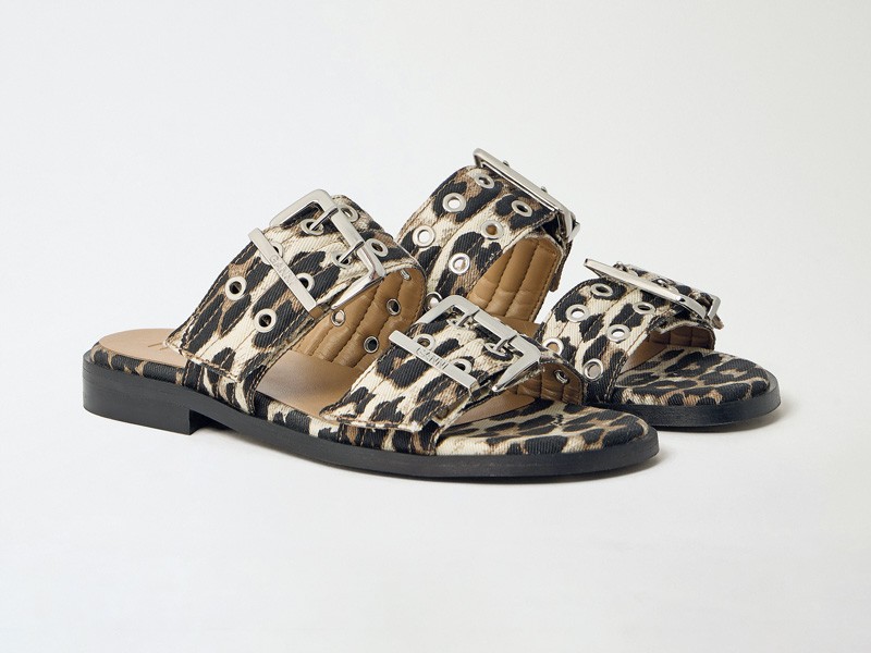 Hardware transforms sandals through buckles, studs and crossings