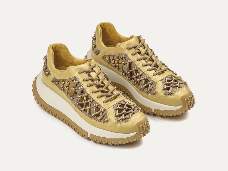 Fashion sneakers combine cutouts, laces and wavy soles