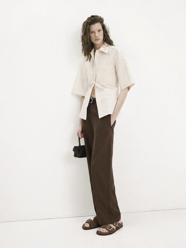 Hardware transforms sandals through buckles, studs and crossings