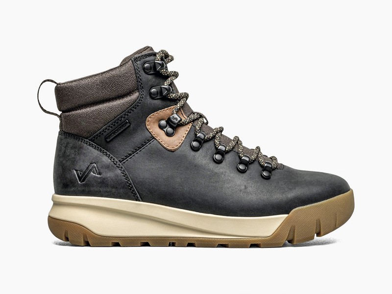 Workwear boots with track soles and visible stitching