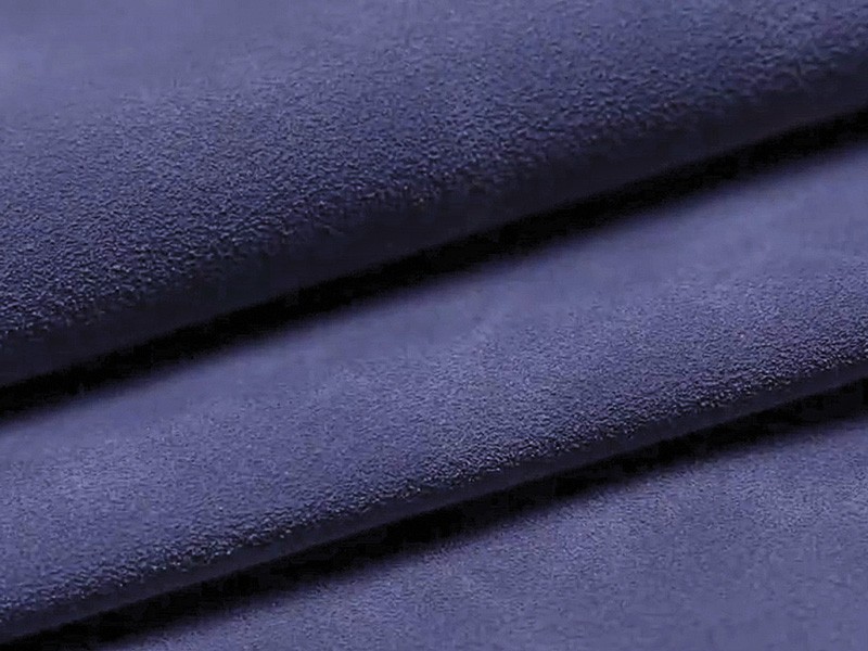 Fine-grain matte footwear upper material shown in folded layers to highlight surface texture and consistency. How to Specify Synthetic Materials for Footwear: Flexing, Hydrolysis, Abrasion and Application