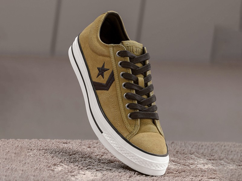 Olive-toned urban sneakers with suede cues and gum sole units