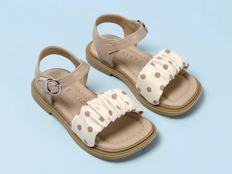 Open children’s shoes: Joyful steps