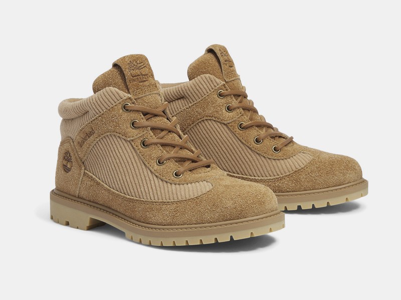 Workwear boots with track soles and visible stitching