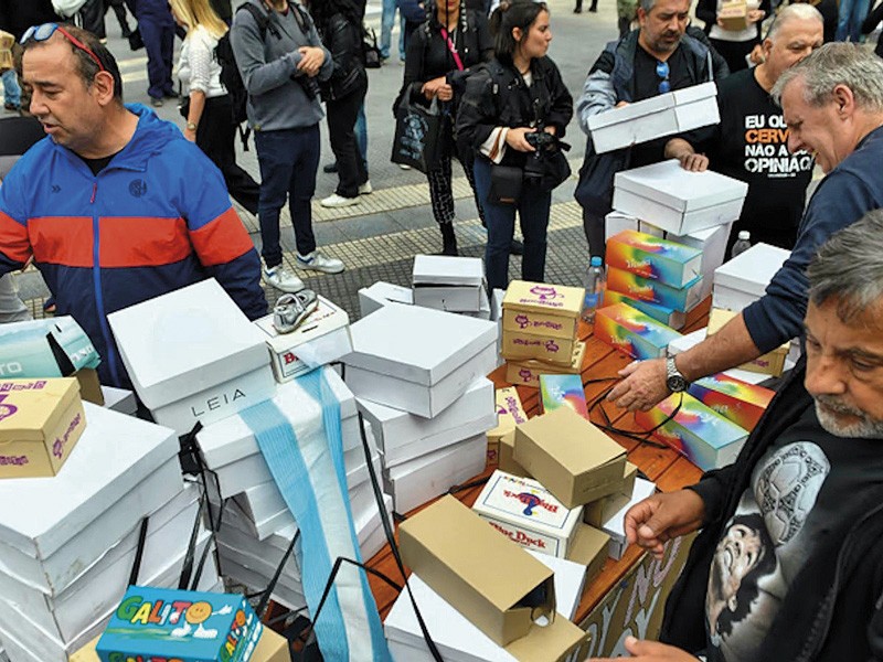 For several hours, the shoemakers were too busy to hand out shoes to passersby.