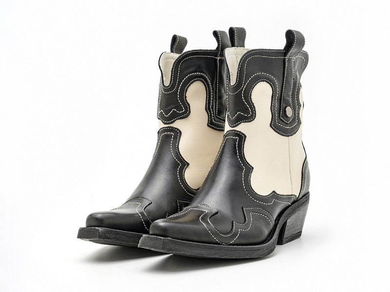 Cowboy boots with tall shafts and pointed toes