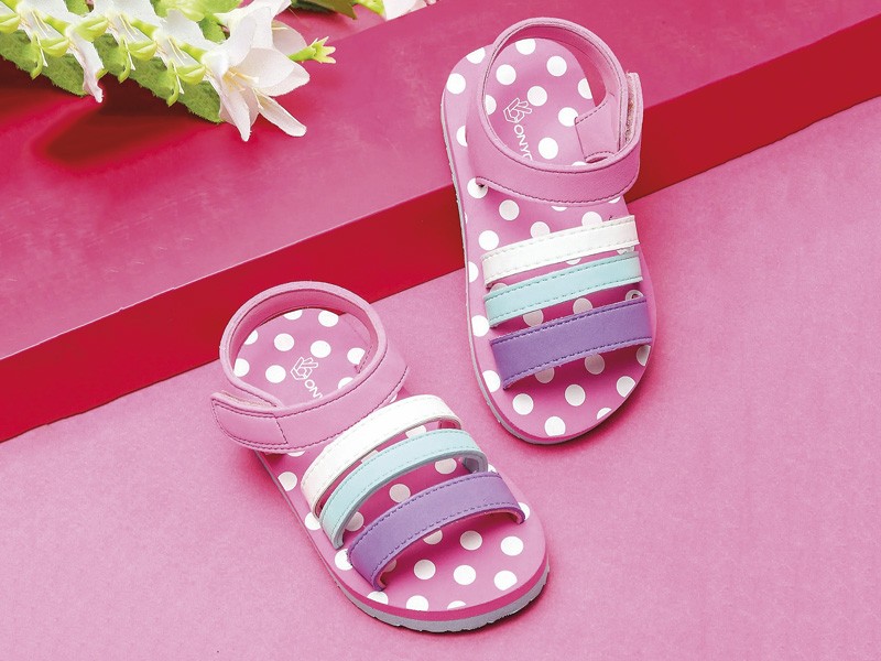 Open children’s shoes: Joyful steps