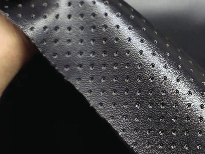 Perforated synthetic footwear upper material showing grain and perforation pattern. How to Specify Synthetic Materials for Footwear: Flexing, Hydrolysis, Abrasion and Application